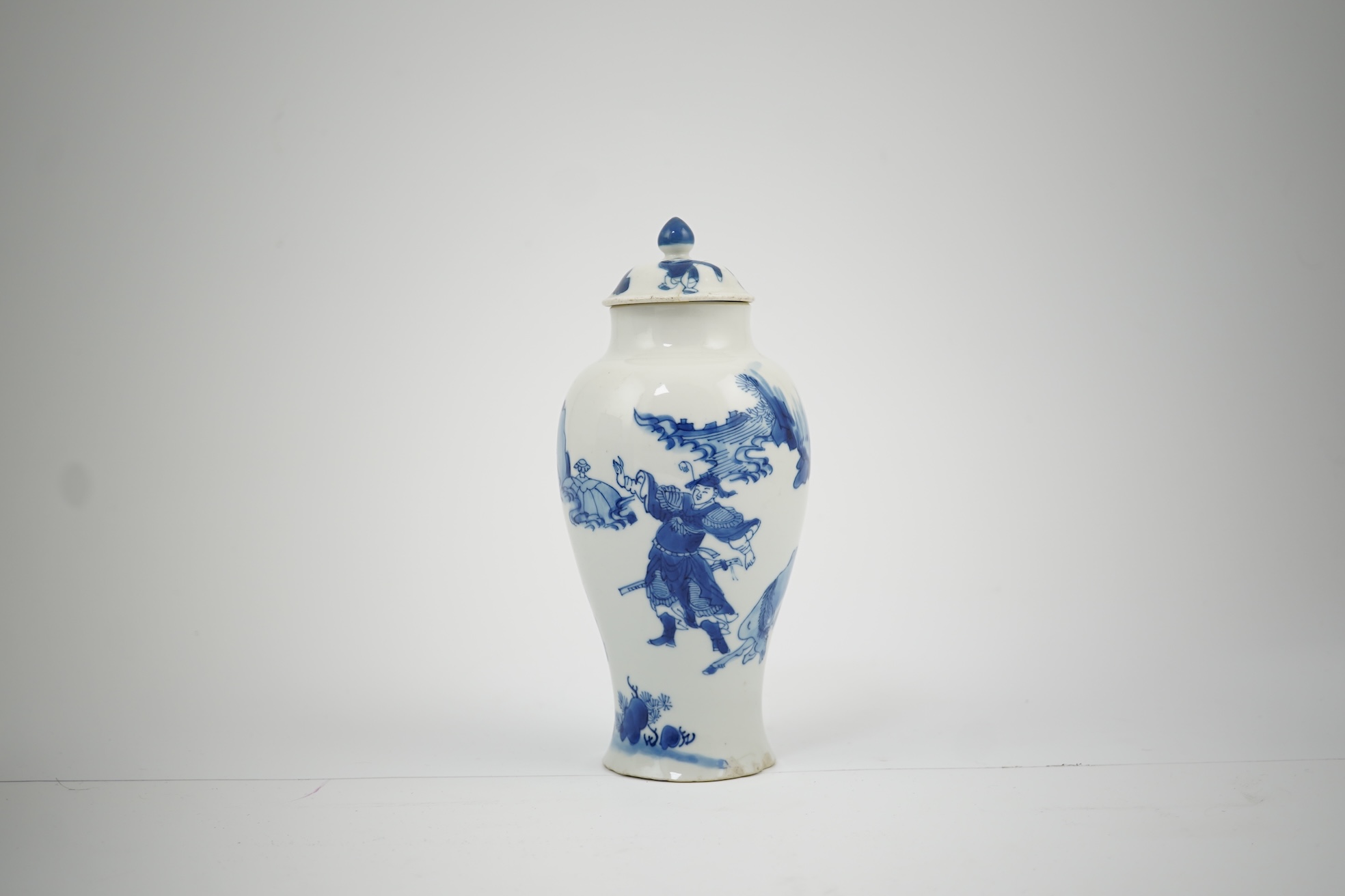 A Chinese blue and white baluster vase, early Kangxi, and associated cover